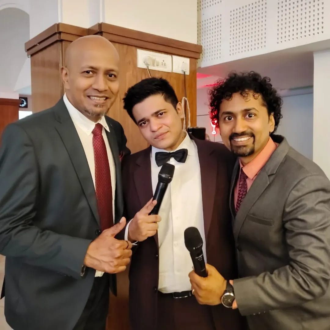 Hosts together at an event